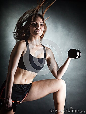 Fitness girl training shoulder muscles lifting dumbbells Stock Photo