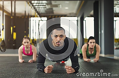 Fitness group plank training indoors Stock Photo