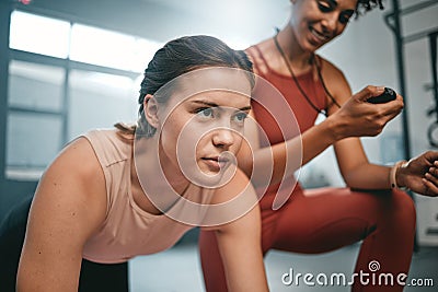 Fitness, gym client and personal trainer with time of health exercise, performance workout or core muscle building Stock Photo