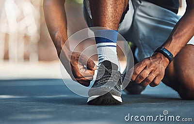 Fitness, hands or black man tie shoes lace before start of running exercise, fitness training or sports workout. Health Stock Photo