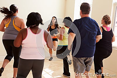 Fitness Instructor In Exercise Class For Overweight People Stock Photo