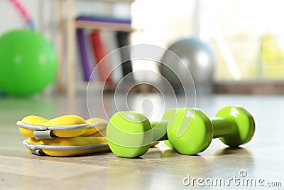 Fitness inventory on floor in spacious gym. Rehabilitation medicine Stock Photo