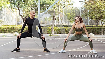 Fitness and jogging. Attractive woman and man exercising outdoor Stock Photo