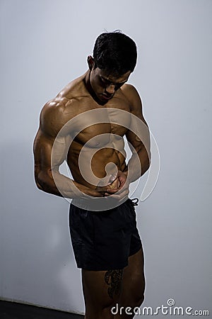 Fitness Model Torso With Pectoral Muscles Flexed Stock Photo