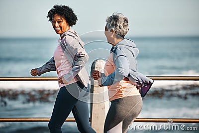 Fitness, running and senior women by ocean for healthy lifestyle, wellness and cardio on promenade. Sports, friends and Stock Photo