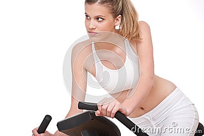 Fitness series - Young woman with exercise bike Stock Photo