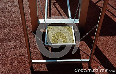 Fitness sports fields with stainless steel tools resemble torture tools with chains and handles. soft rubber surface sports ground Stock Photo