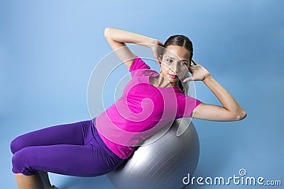 Fitness Woman doing an abdominal exercise Stock Photo