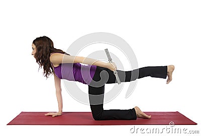 Fitness woman doing kneeling triceps kickback Stock Photo