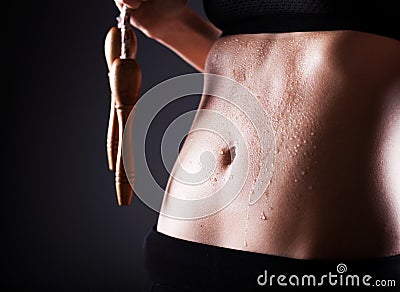 Fitness woman after exercise with jumping rope Stock Photo