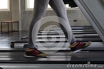 Fitness woman in leging sportware walking on treadmill machine Stock Photo