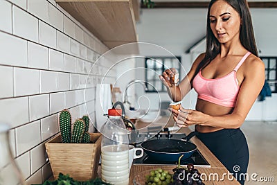 Fitness woman prepare breakfast. Healthy homemade oatmeal with vegetables Stock Photo