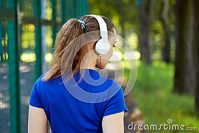 Fitness woman resting after intense physical training listerning to music Stock Photo