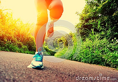 Fitness woman runner running on trail Stock Photo