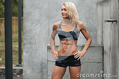 Fitness woman shaped abdominal outdoors. Athletic girl with flat belly, abs Stock Photo