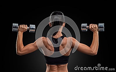 Fitness woman in training muscles of the back with dumbbells Stock Photo