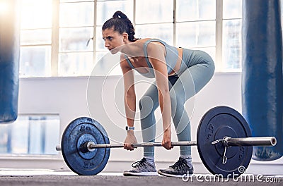 Fitness, woman and weightlifting barbell for workout, exercise or intense training at the gym. Active female exercising Stock Photo