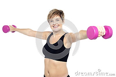 Fitness woman working out with pink dumbbells Stock Photo