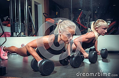 Fitness women doing push up Stock Photo
