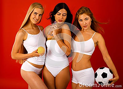 Fitness women. Young beautiful girlfriends in white sportswear Stock Photo