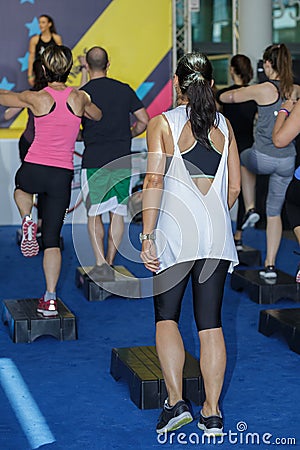 Fitness Workout: Girls Doing Exercises in Class at Gym with Step Platform Editorial Stock Photo