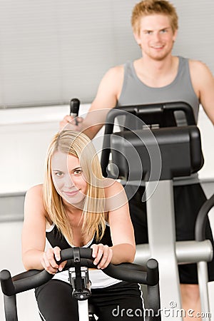 Fitness young girl on gym bike Stock Photo