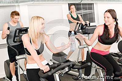 Fitness young girl on gym bike Stock Photo