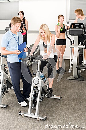 Fitness young girls at gym with instructor Stock Photo