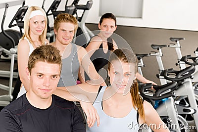 Fitness young group people at gym bicycle Stock Photo