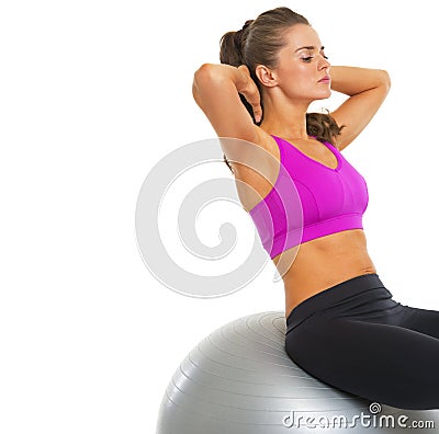 Fitness young woman doing abdominal crunch on fitness ball Stock Photo