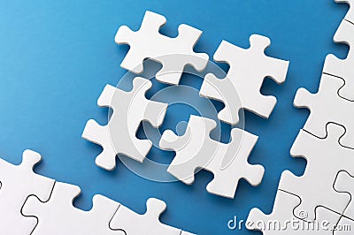 Fitting four puzzle pieces. Stock Photo
