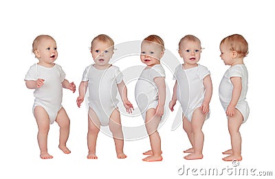 Five adorable babies learning to walk Stock Photo