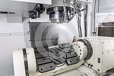 Five axis milling machining center. Interior of a 5 axis milling machine. Milling machine with a rotary table. Multi axis CNC Stock Photo