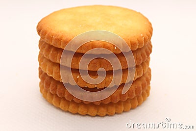 five biscuits stacked on a white background. Stock Photo