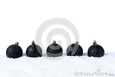 Five Black christmas balls with snow on white background Stock Photo
