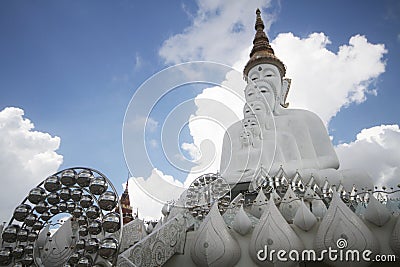 Five buddha statues sitting well alignment and decorated with fine jewelry and gold attractive mirror Stock Photo