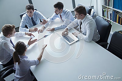 Five business people having a business meeting at the table in the office Stock Photo