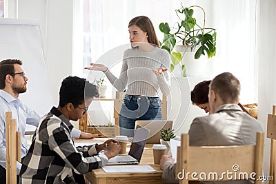 Five businesspeople discussing at seminar in conference room Stock Photo