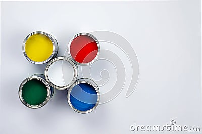 Five cans of multicolored paint on a white background Stock Photo