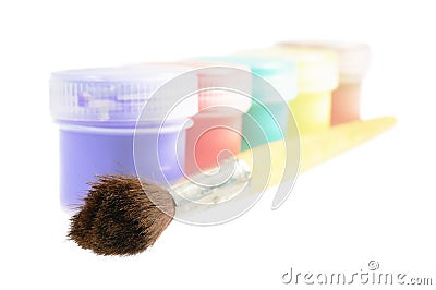 Five cans of paint and brush Stock Photo