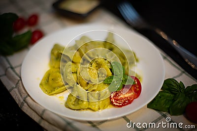 Five Cheeses ravioli with pesto Stock Photo