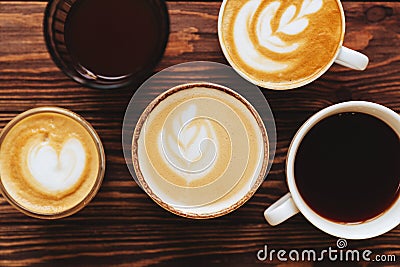 Five cups of coffee on vintage wood. Top view , cup on wooden table. Stock Photo