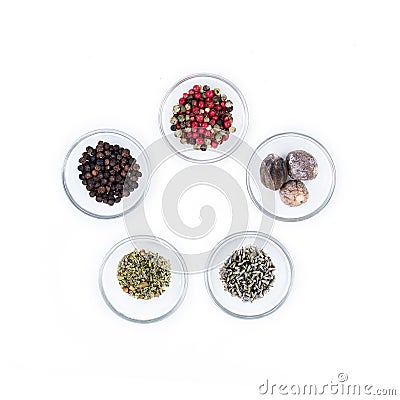 Five different kind of dry spices on glass cups from above Stock Photo