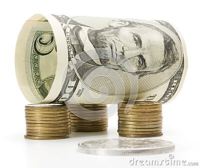 Five dollar bill over stack of coins Stock Photo