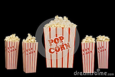 Five Full Popcorn Containers Isolated on Black Stock Photo