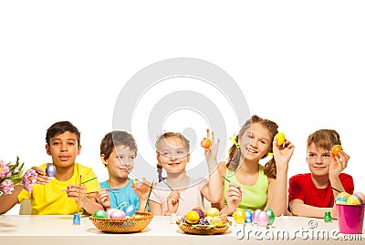 Five funny children with colourful Eastern eggs Stock Photo