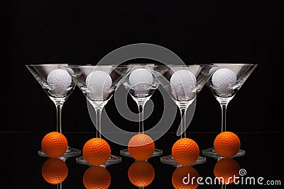 Five glasses of champagne and different golf balls Stock Photo