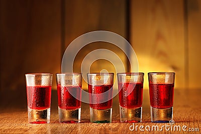 Five glasses with cranberry vodka Stock Photo