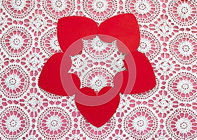 Five hearts in a circle on a white doily against a pink background Stock Photo