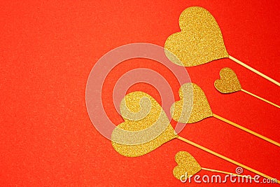 Five hearts of yellow on a red background. View from above. Hearts are on the right. Concussion is love. Valentine is Day. Romance Stock Photo